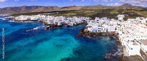 Canary islands travel. Lanzarote scenic places. Charming Punta Mujeres traditional fishing village. aerial drone view. popular for natural swim pools.