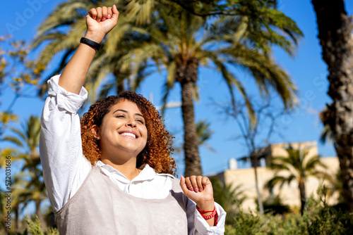 Excited woman celebrating success at university