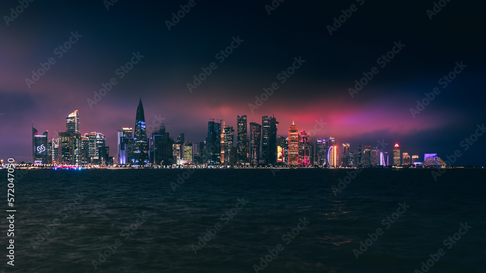 doha skyline at night, skyscrapers standing tall and in line in the concrete jungle doha skyline at night, skyscrapers standing tall and in line in the concrete jungle