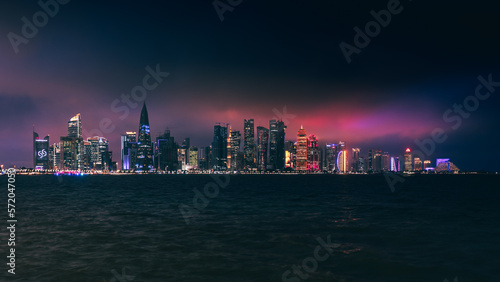 doha skyline at night, skyscrapers standing tall and in line in the concrete jungle