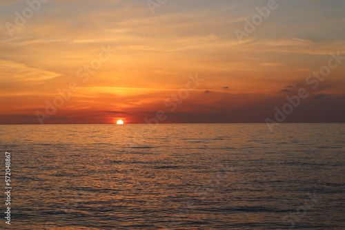 Sunset over the sea on the coast of Italy © Vasilisa