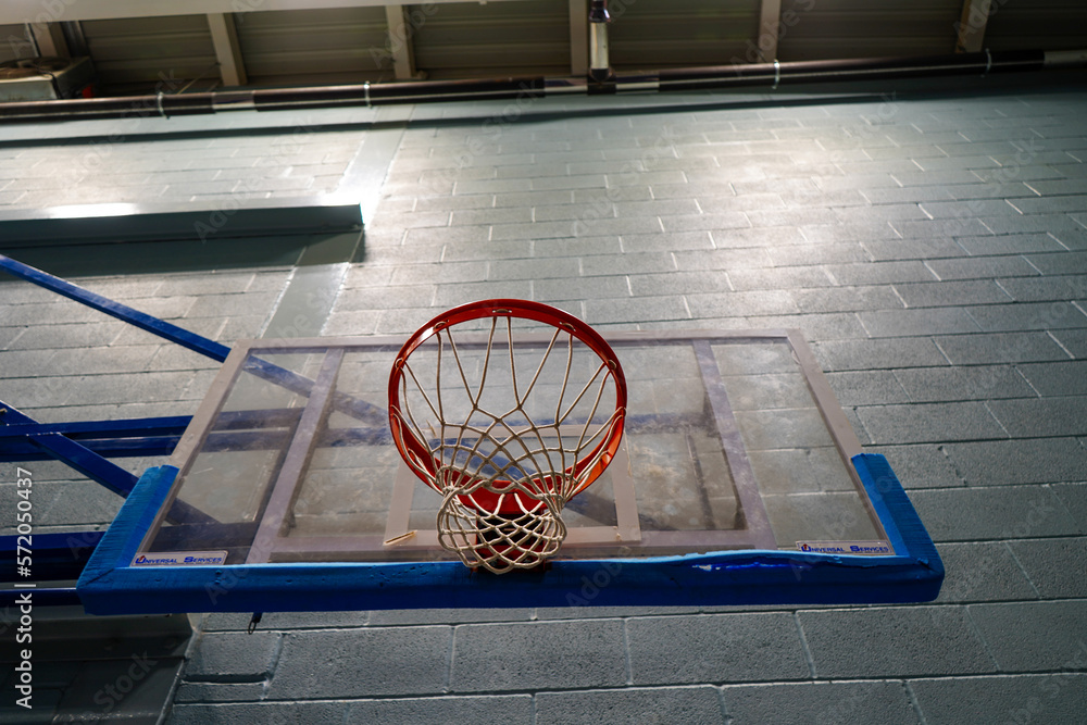Looking up at a basketball hoop and backboard