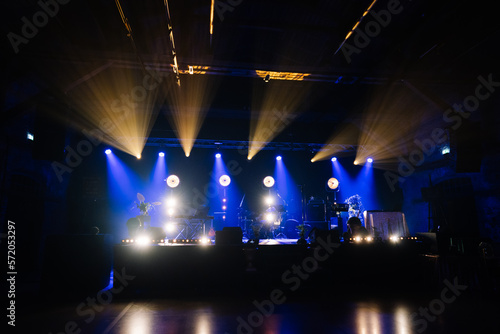An empty stage of the theater, lit by spotlights and smoke before the performance © Raivo
