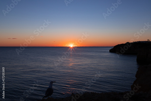 Landscape of the rocky coast of Faro Algarve - Portugal in the evening