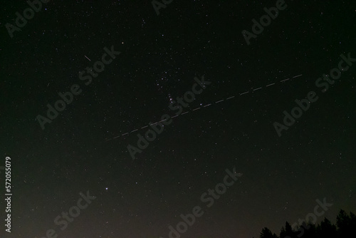 The Starlink-Chain crossing Orion . Starlink-Satellites . Starlink-Kette photo