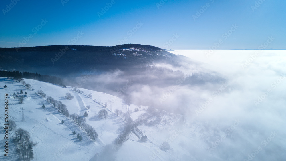 Aerial view of Mountains in winter foggy morning. Owl Mountains, Poland. 