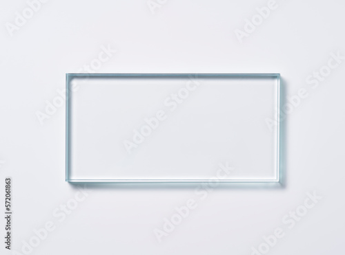 Glass square shapes on a light background.