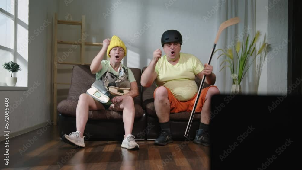 excited-people-cheering-for-favorite-ice-hockey-team-as-they-watch-of