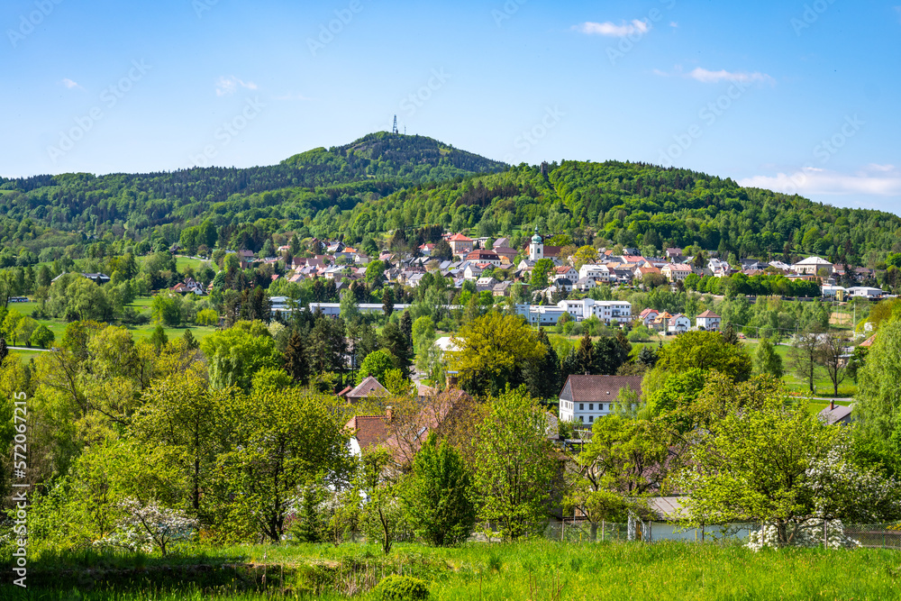 Jedlova Mountain and Jiretin pod Jedlovou town on sunny day. Lusatian Mountains, Czech Republic Jedlova Mountain and Jiretin pod Jedlovou town on sunny day. Lusatian Mountains, Czech Republic