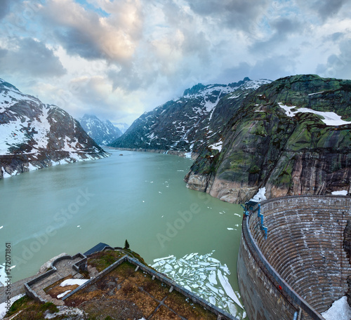 View from the summit of the pass looking north over the Grimselsee (Switzerland, Bernese Alps). photo