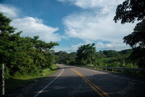 Highway between tropical trees in Colombia.