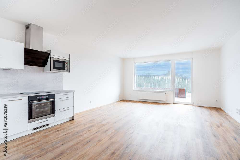 new empty room with kitchen and window in residential house new empty room with kitchen and window in residential house