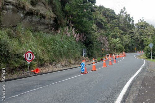 Photography Following tropical storm Cyclone Gabrielle a land slip has occurred blocking one half of a road
