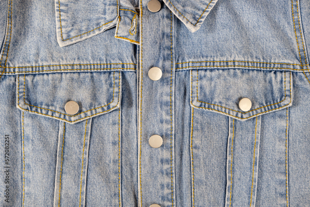Denim jacket close-up. Blue jeans texture, design. Denim jacket close-up. Blue jeans texture, design.