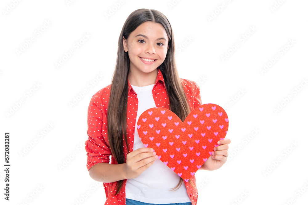 Lovely romantic teenage girl hold red heart symbol of love for valentines day isolated on white background. Portrait of happy smiling teenage child girl.
