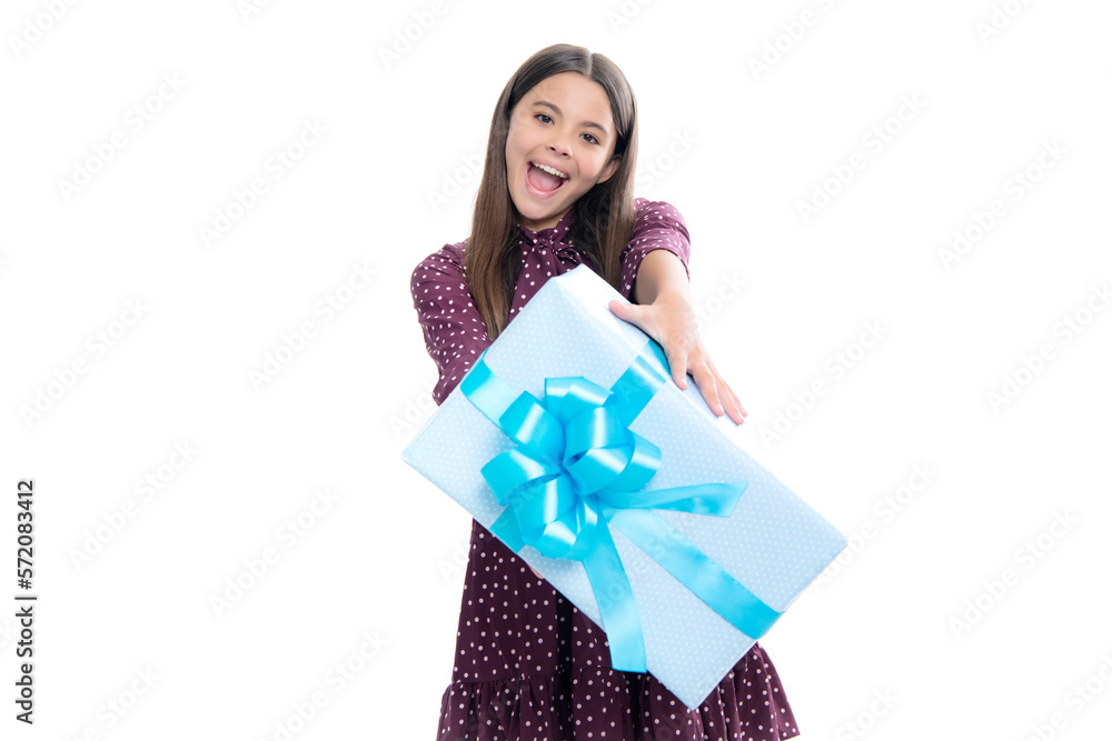 Child with gift present box on isolated studio background. Gifting for kids birthday. Portrait of emotional amazed excited teen girl. Child with gift present box on isolated studio background. Gifting for kids birthday. Portrait of emotional amazed excited teen girl.
