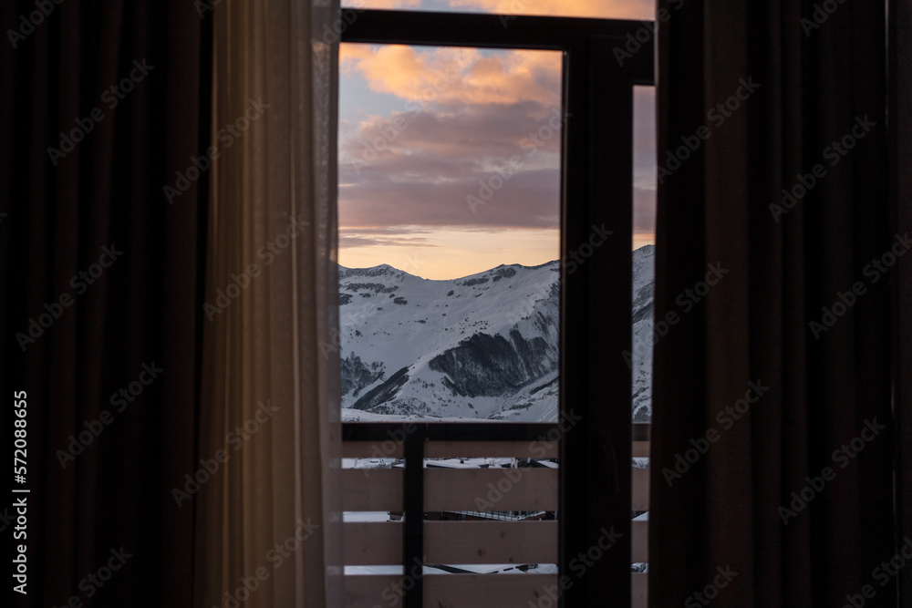 beautiful view from hotel room window at winter mountain at ski resort, sunset beautiful view from hotel room window at winter mountain at ski resort, sunset