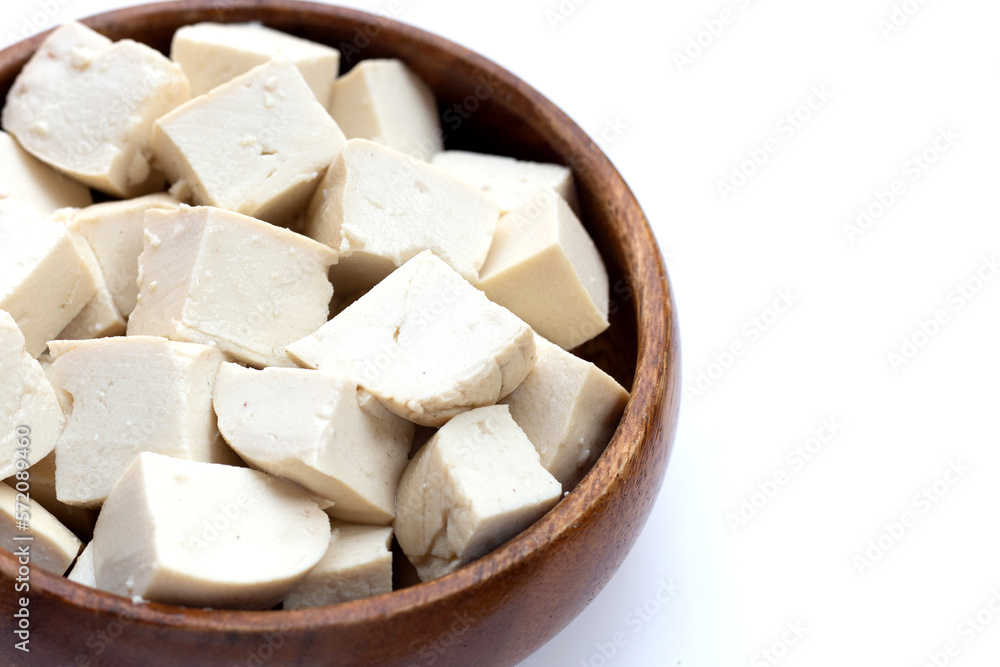 White tofu in wooden bowl on white background. White tofu in wooden bowl on white background.