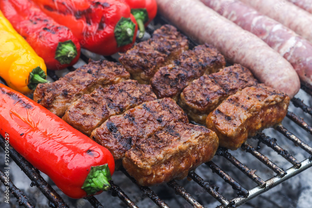 Meat cutlets with pepper on the grill.