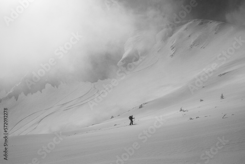 Ski touring in mountains, winter freeride extreme sport