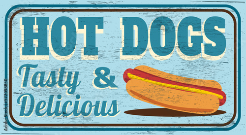 Tasty and delicious hot dogs vintage sign on wood