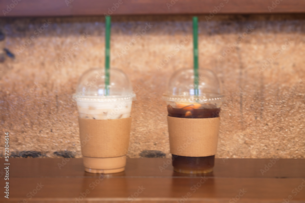 Iced coffee with orange and iced cappucino in coffee shop Iced coffee with orange and iced cappucino in coffee shop