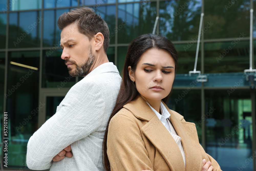 Upset arguing couple near building outdoors. Relationship problems Upset arguing couple near building outdoors. Relationship problems