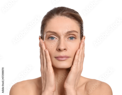 Woman massaging her face on white background