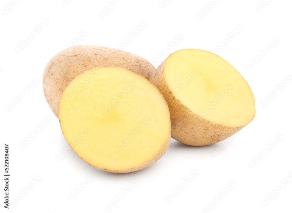 Whole and cut fresh potatoes on white background