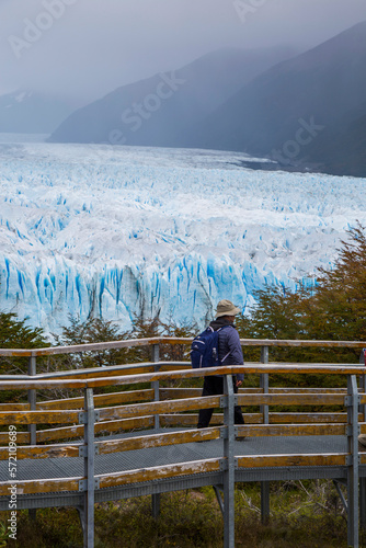 Tourist walks on the footbridges of the Perito Moreno Glacier in Patagonia Argentina