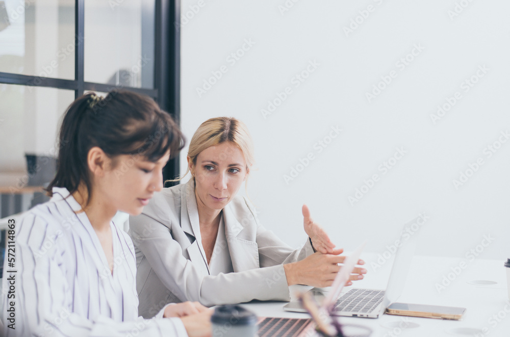 Businesswomen sharing ideas and working a new project in office,Business teamwork concept Businesswomen sharing ideas and working a new project in office,Business teamwork concept