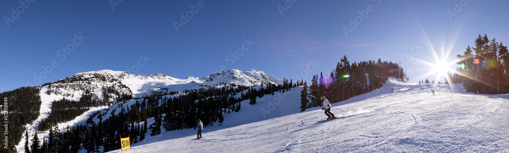 Mountain peak and chair lift with skiers, winter landscape, ski resort, Whistler BC.