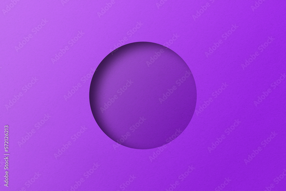 Purple paper cut into circular holes stacked together with light and shadow.