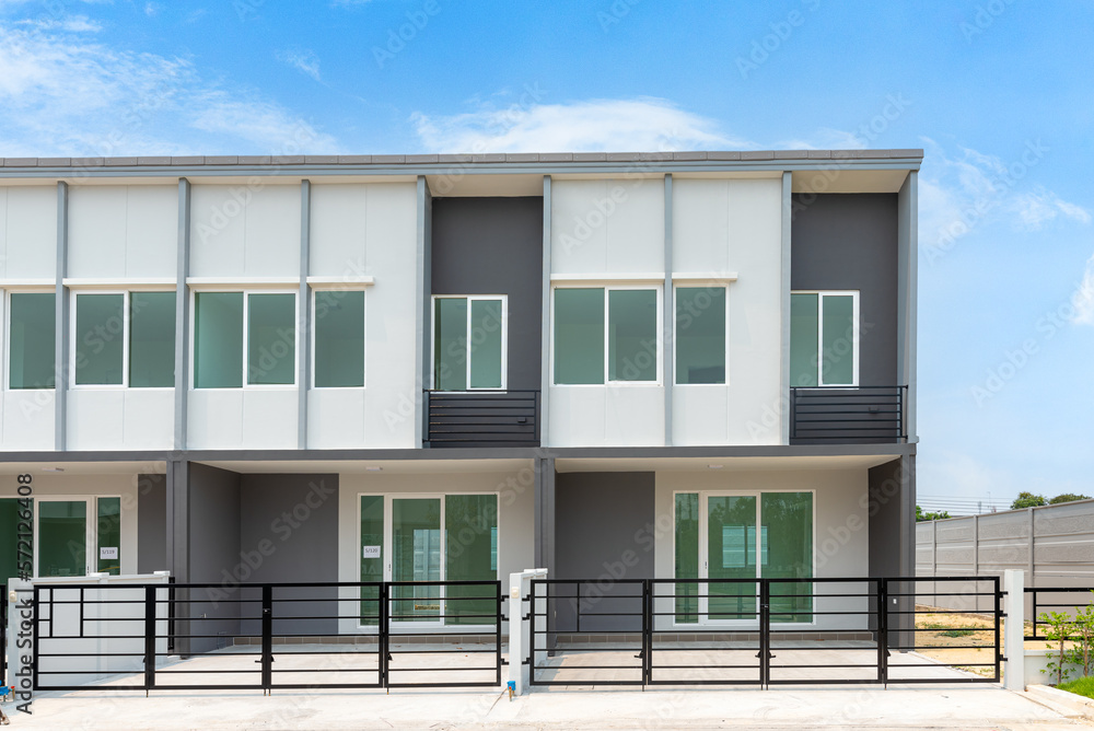 The row of just finished new townhouses with blue sky, Front View of New Residential house, the architectural design of the exterior, The concept for Sale, Rent, Housing, and Real Estate