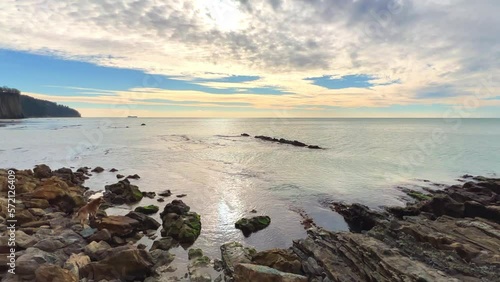 Wallpaper Mural Powerful sea waves are crashing on the Black Sea coast. Waves splash on the beach with pebbles during a storm. Storm at sea. Panoramic view of the Black Sea. Russia. Sunset on the beach. 4K Torontodigital.ca