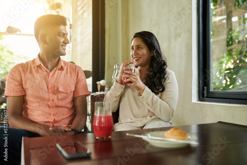 Diverse Couple Having Frutty Drinks