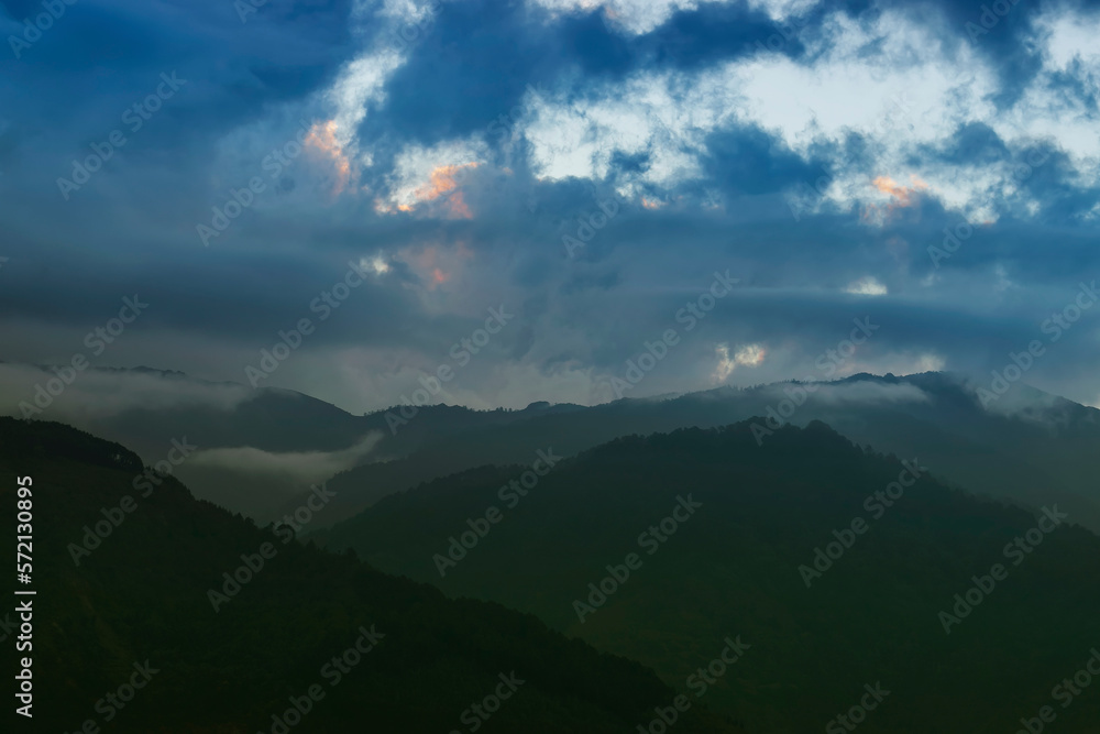 Colourful clouds above Himalayan mountain range after sun has set ...