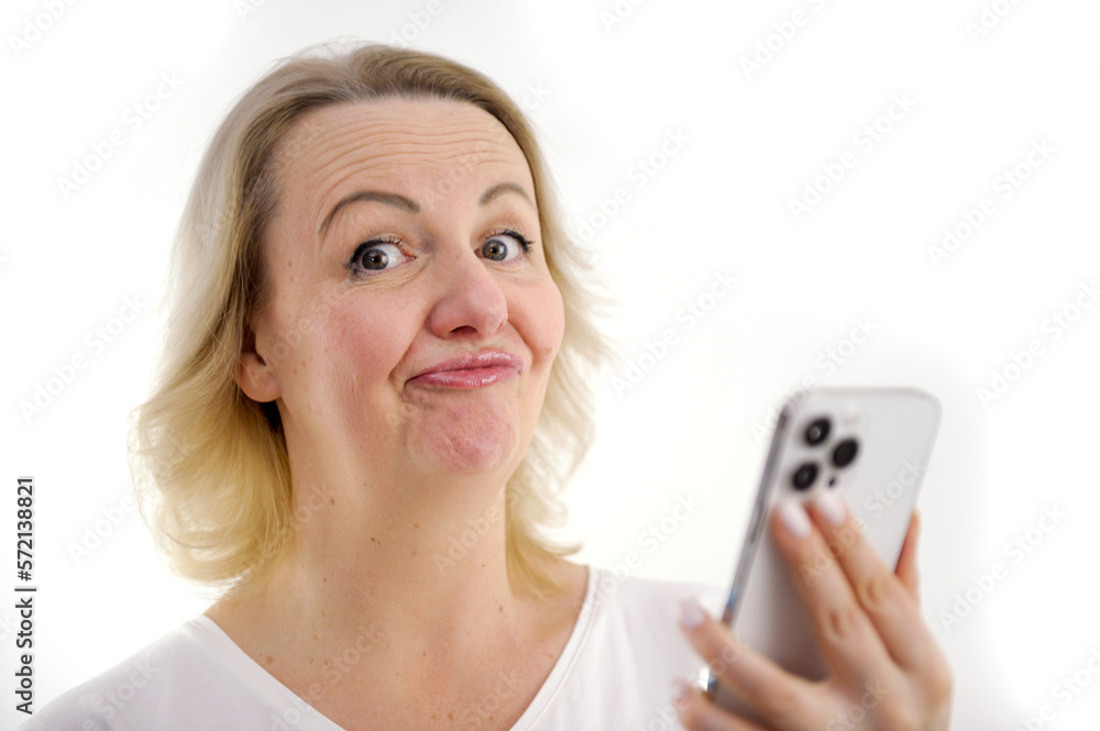 comic photo woman opened eyes wide pressed lips grimaced funny face she does not understand in hands phone she looks at us shows that it was seriously funny interesting curiosity incomprehensible comic photo woman opened eyes wide pressed lips grimaced funny face she does not understand in hands phone she looks at us shows that it was seriously funny interesting curiosity incomprehensible