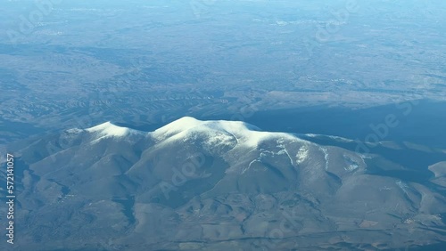 Aerial view of El Moncayo mountain in Zaragoza, Spain. Recorded from a jet cockpit at 12000m high photo