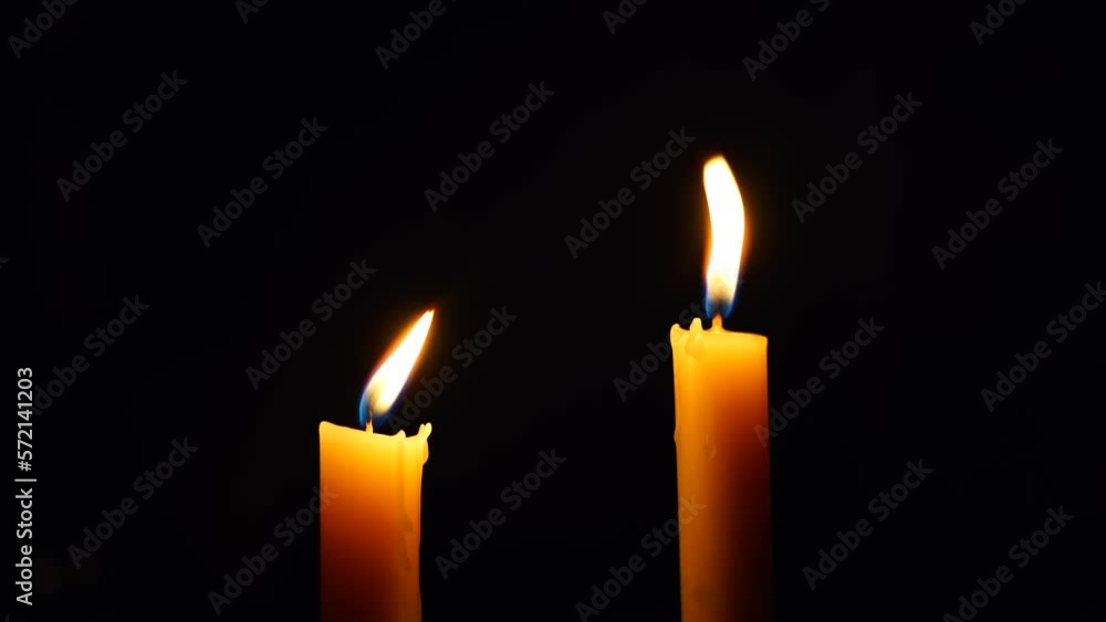 two Candles lighing in the dark after power cut, beautiful colours in the dark two Candles lighing in the dark after power cut, beautiful colours in the dark