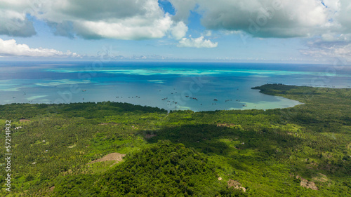 Aerial view of island with jungle and blue sea. Seascape in the tropics. Balabac, Palawan. Philippines.