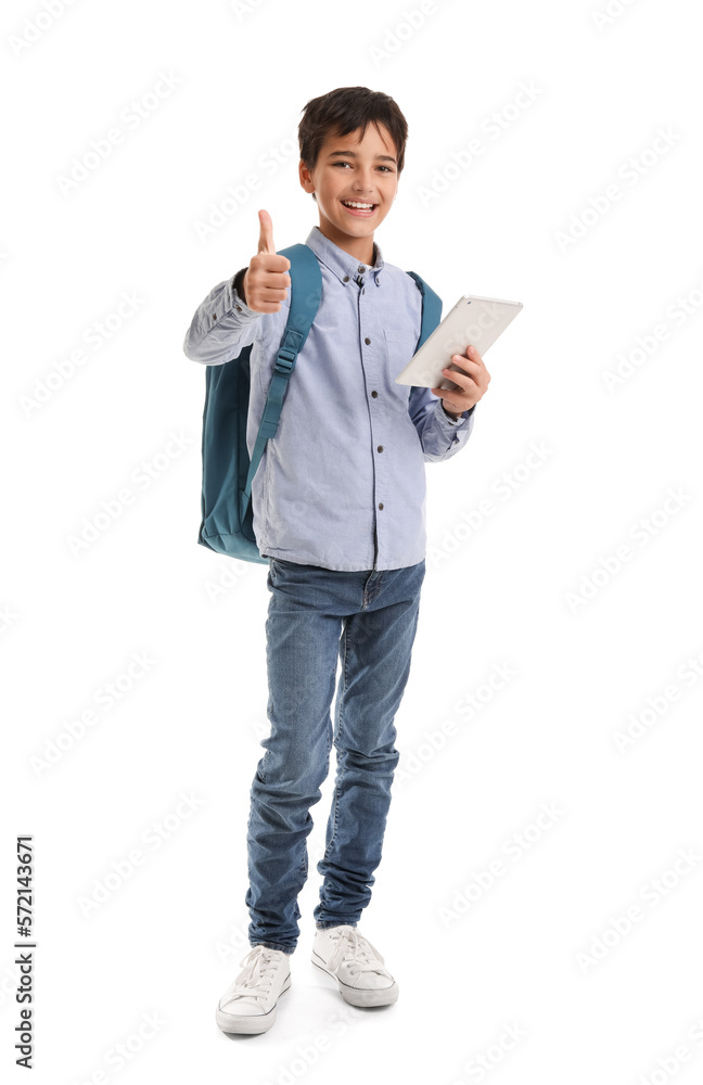 Little schoolboy with tablet computer showing thumb-up on white background Little schoolboy with tablet computer showing thumb-up on white background