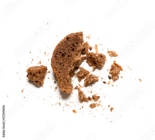 Pieces and crumbs of rye bread isolated on white background