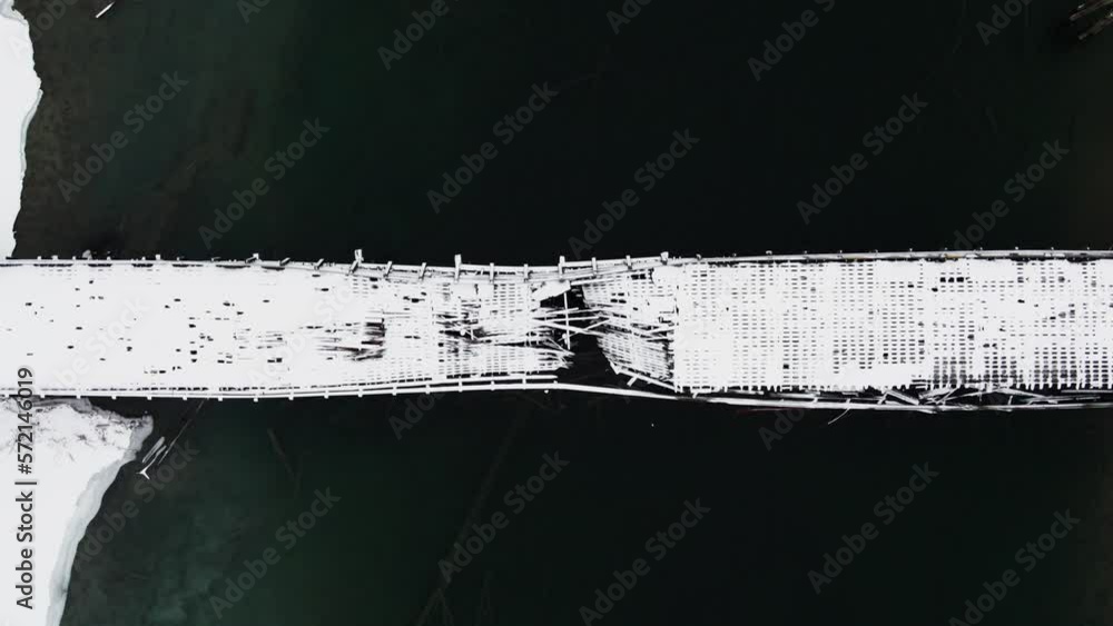 A Drone's Eye View of the Broken Wooden Bridge over Adams River, Abandoned Crossing in British Columbia Canada A Drone's Eye View of the Broken Wooden Bridge over Adams River, Abandoned Crossing in British Columbia Canada