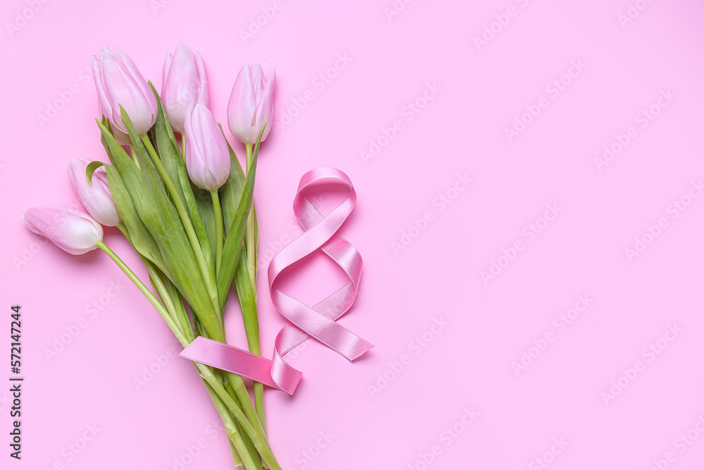Bouquet of beautiful tulip flowers and figure 8 made of ribbon on pink background. Women's Day celebration