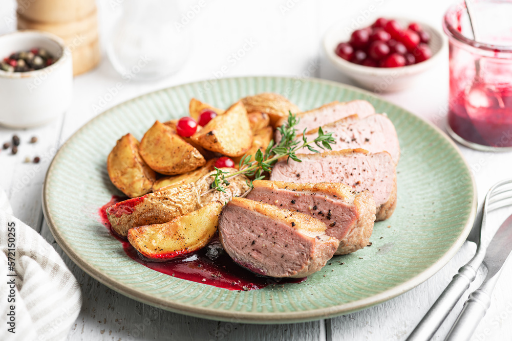Duck breast steak with potatoes and berry sauce Duck breast steak with potatoes and berry sauce