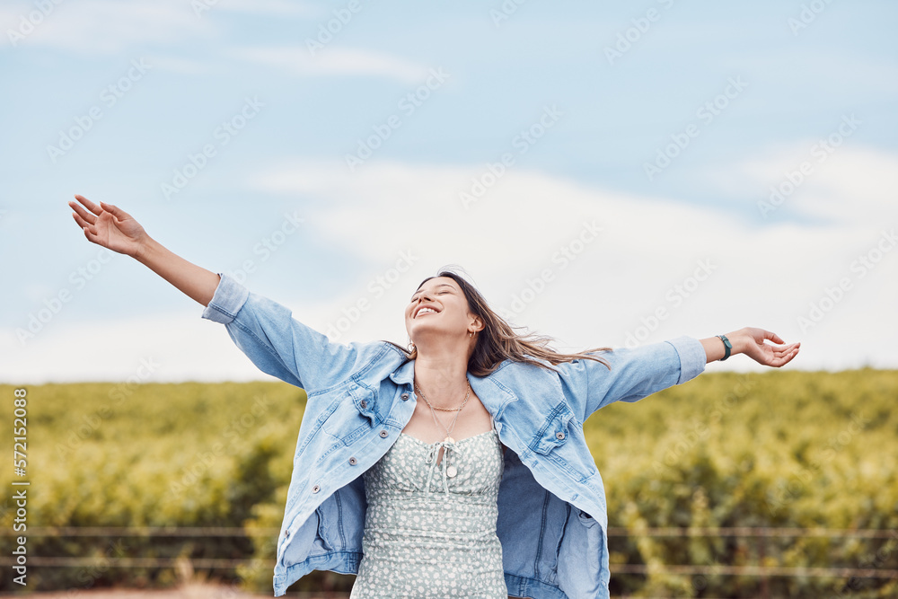 Happy, freedom and smile with woman in nature for peace, relax and youth with blue sky mockup. Journey, adventure and happiness with girl enjoying outdoors for summer break, vacation and holiday