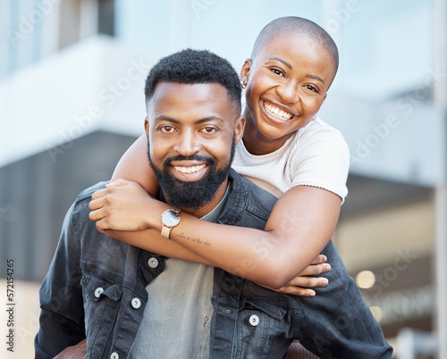 Piggyback, black couple and portrait in city for love, care and happiness on date together in Nigeria. Happy man carrying woman in urban street, town and outdoor for fun, freedom and relax with smile