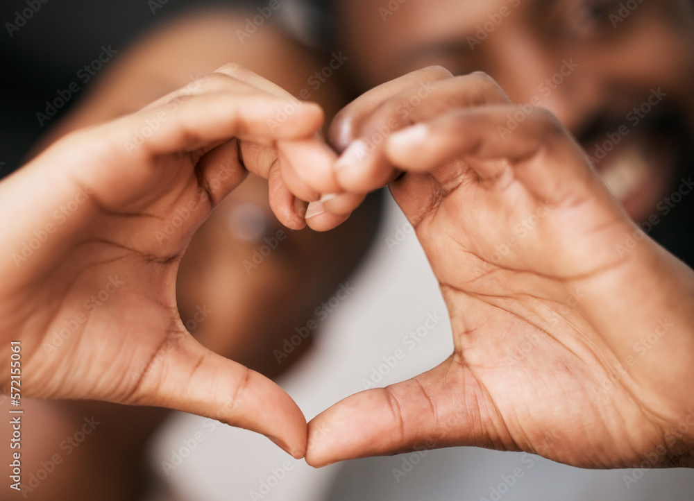 Love, hands in heart and happy black couple for relationship, dating and commitment in home. Valentines day, emoji sign and black woman and man smile with hand shape for bonding, romance and trust Love, hands in heart and happy black couple for relationship, dating and commitment in home. Valentines day, emoji sign and black woman and man smile with hand shape for bonding, romance and trust