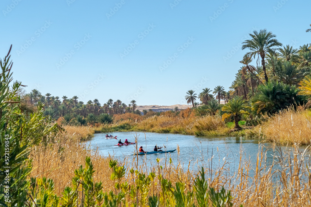 Unrecognizable people kayaking in Kerrouche stretch of water. Green and